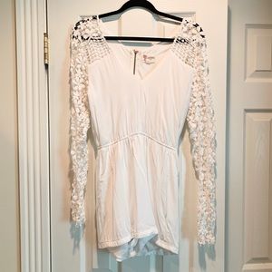 Stunning white romper with floral sleeve detail